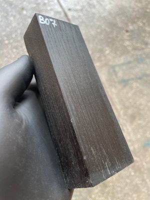 Matched pair of stabilized bog oak knife scales with natural prehistoric wood figure, ready for custom knife projects.