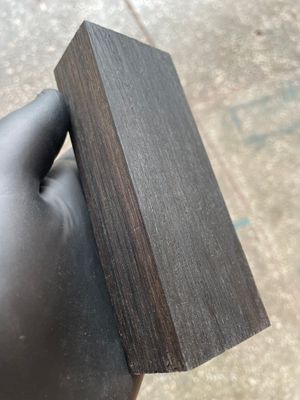 Premium stabilized bog oak scales showcasing rich dark tones and unique grain patterns, ideal for custom knife making.
