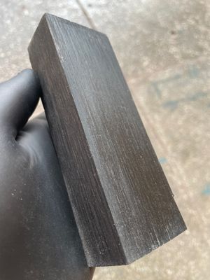 Premium stabilized bog oak scales showcasing rich dark tones and unique grain patterns, ideal for custom knife making.
