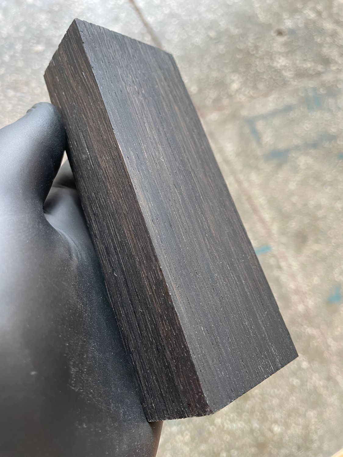Premium stabilized bog oak scales showcasing rich dark tones and unique grain patterns, ideal for custom knife making.
