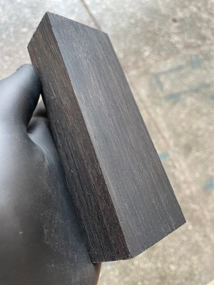 Premium stabilized bog oak scales showcasing rich dark tones and unique grain patterns, ideal for custom knife making.

