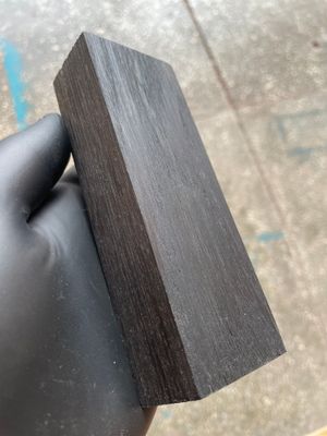 Premium stabilized bog oak scales showcasing rich dark tones and unique grain patterns, ideal for custom knife making.
