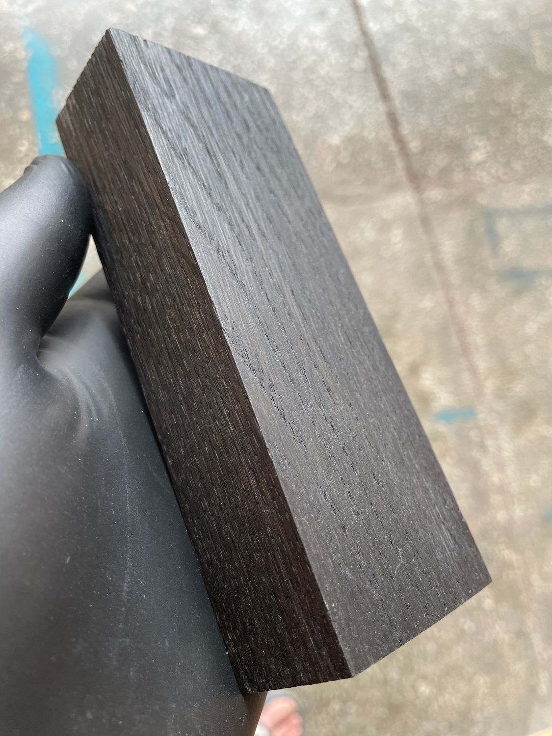 Premium stabilized bog oak scales showcasing rich dark tones and unique grain patterns, ideal for custom knife making.
