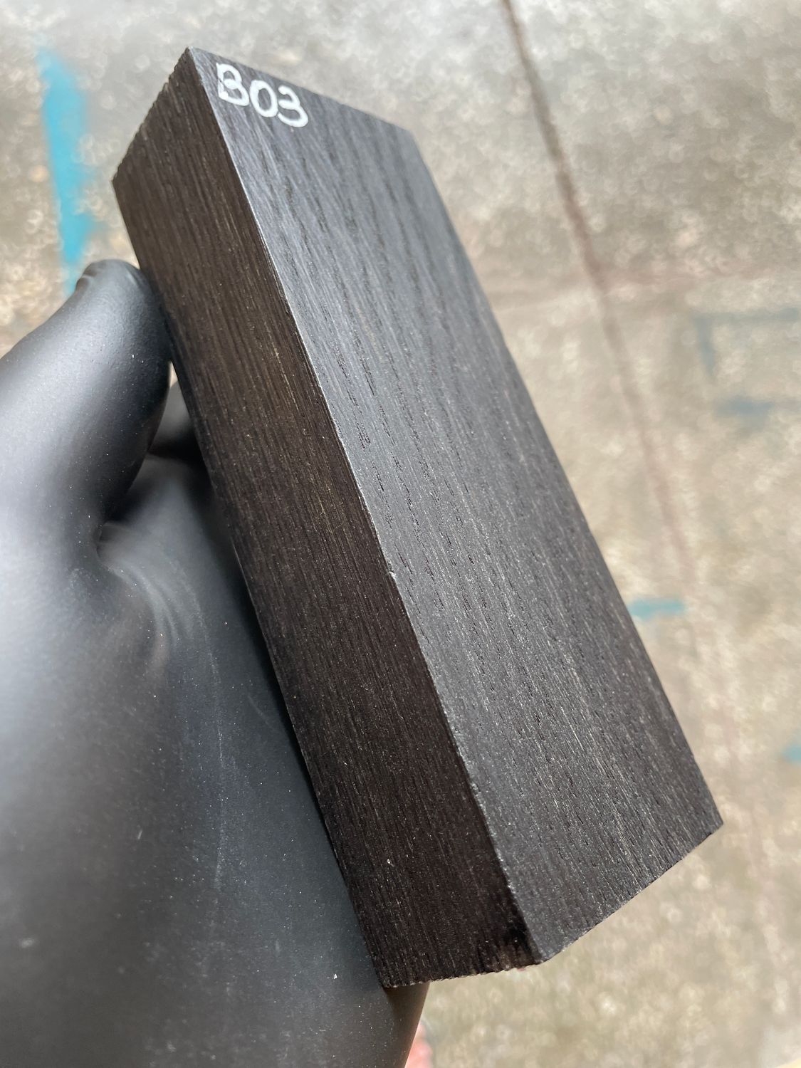 Stabilized bog oak knife scales with deep black color and natural ancient wood grain, matched pair for custom knife handles.