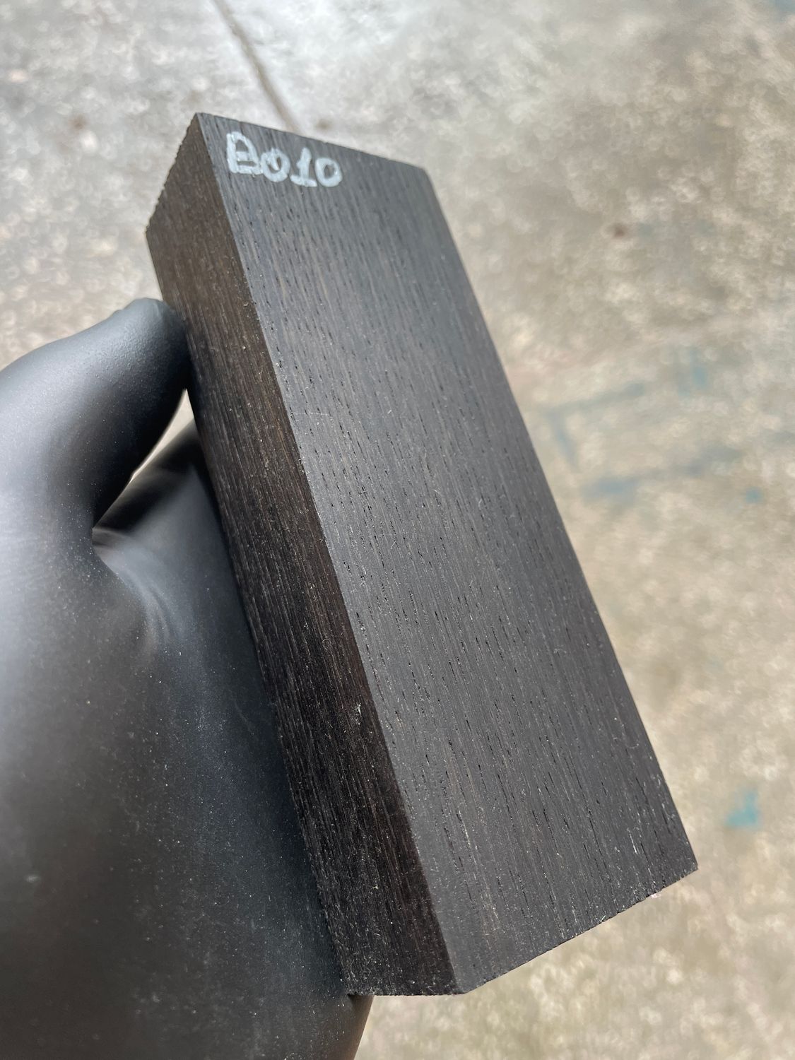 Matched pair of stabilized bog oak knife scales with natural prehistoric wood figure, ready for custom knife projects.