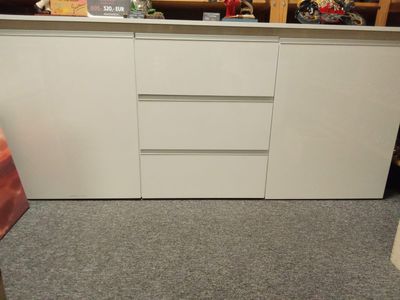 White chest of drawers with shelves and drawers
The chest of drawers has a recess for LED lighting above.