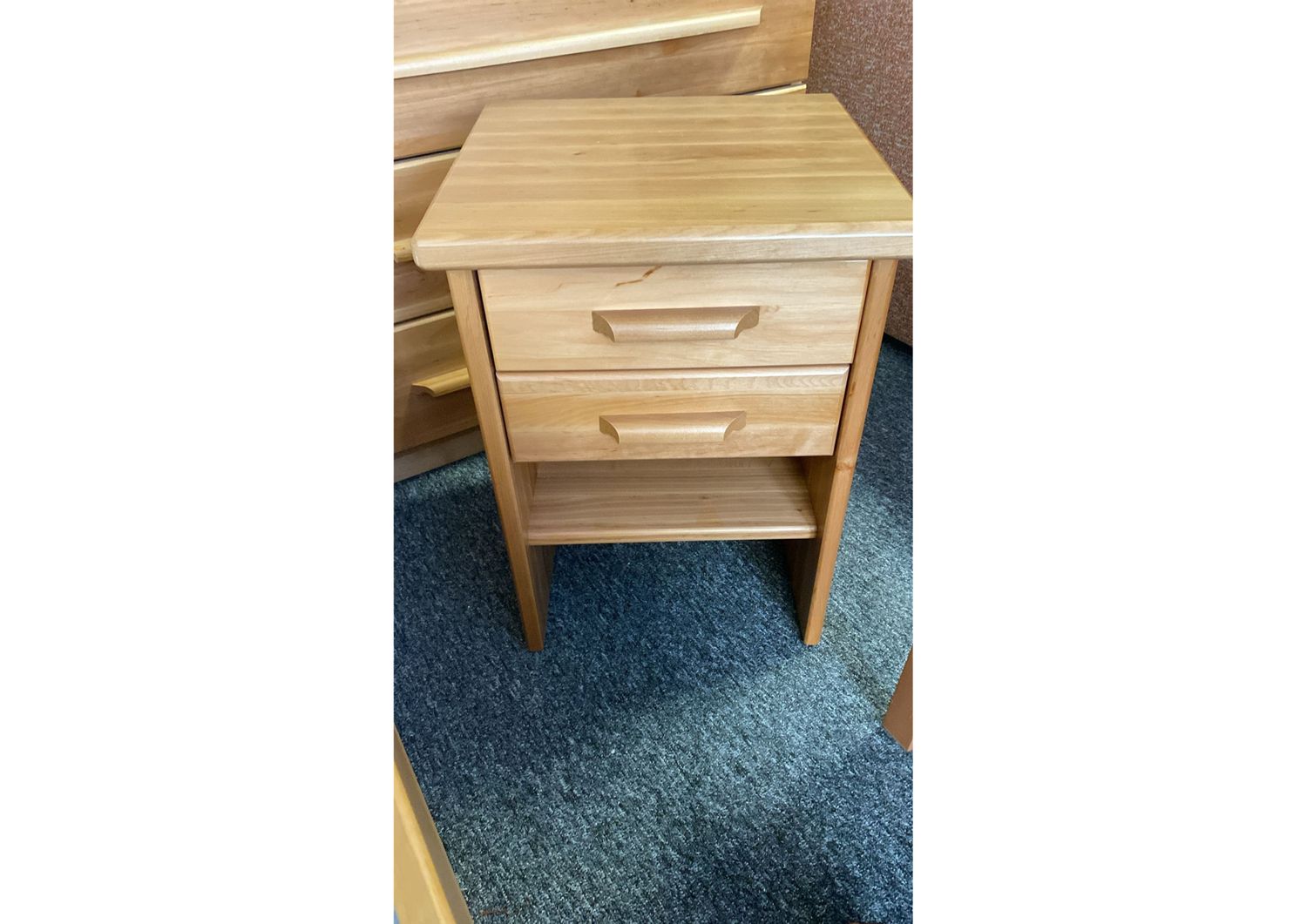 Bedside table in solid alder, available in four finishes: alder, white milk, walnut and mahogany. Made in Latvia.Manx Mēbeles