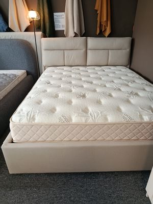 A beige bed with a storage box and removable pillows at Manx Mēbeles. Aurora bed. Dimensions: 140 x 200, 160 x 200, 180 x 200