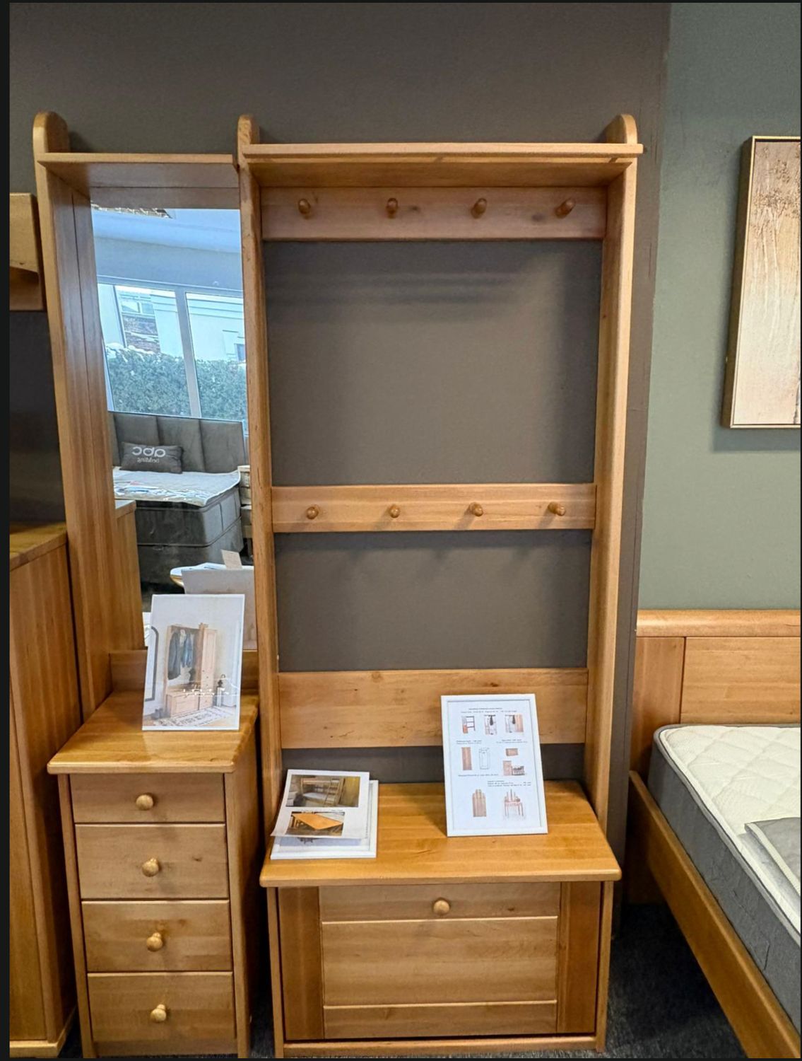 Solid wood hallway set on display at the Manx Mēbeles furniture store. Pictured here with a shoe cabinet. 
