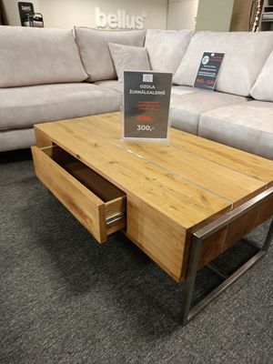 Oak coffee table with metal accents. Dimensions: 110 x 60 cm. Height: 42 cm. Coffee table with a drawer. On sale. 