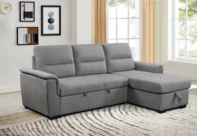 Gray pull-out corner sofa with storage compartment. Versatile corner design. Sofa dimensions: 239 x 155 x 98 cm. Sleeping are