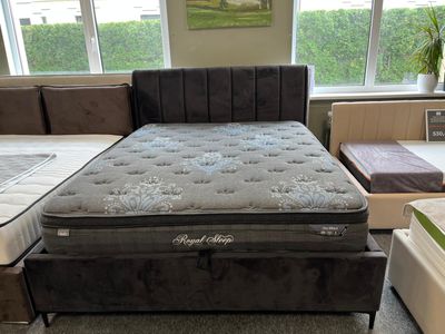 A modern black bed with a storage compartment, available with/ without a mattress. The bed features black metal legs. 160,180