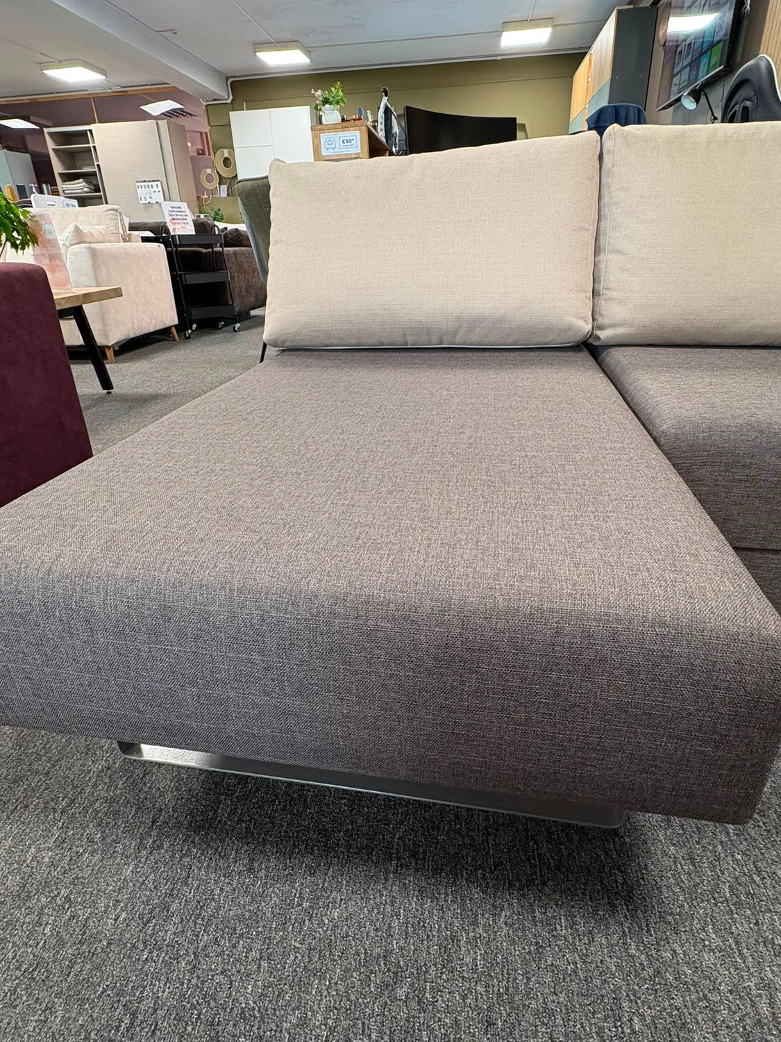 Transformer 2 extendable sofa display model with Bonell springs, storage compartment and spacious sleeping area.