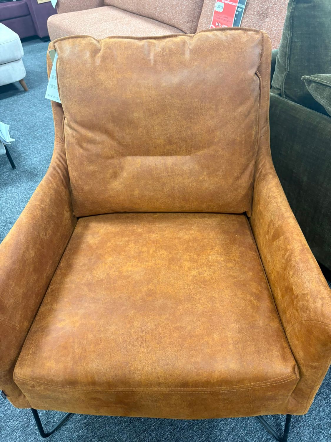 Martin armchair with comfortable HR and ERX foam seating and a choice of metal or wooden legs.