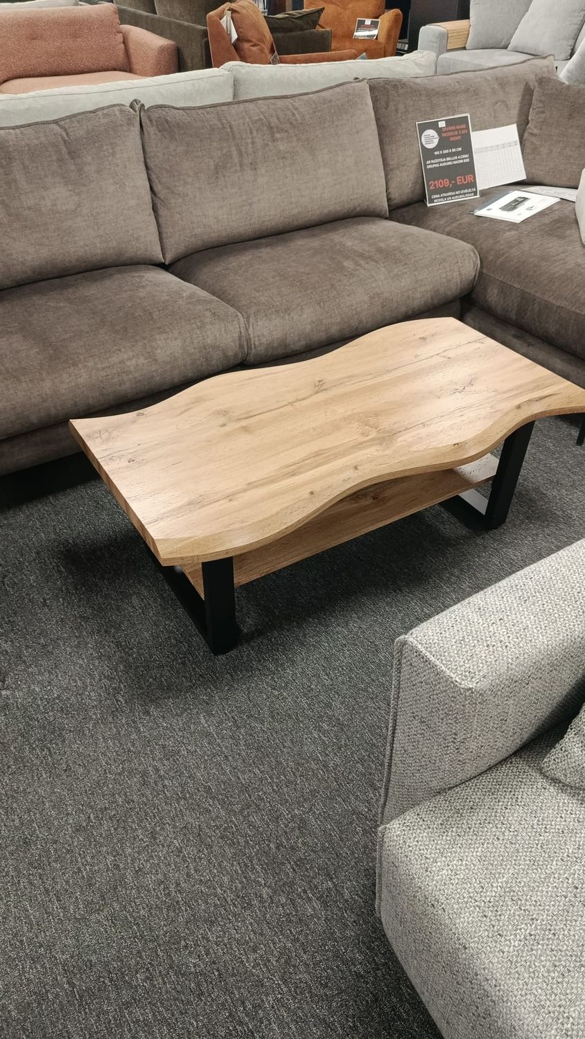 Coffee table with wavy edges, 110 x 60 x 43 cm. Wood-look finish, black legs. Manx Mēbeles furniture store in Jelgava