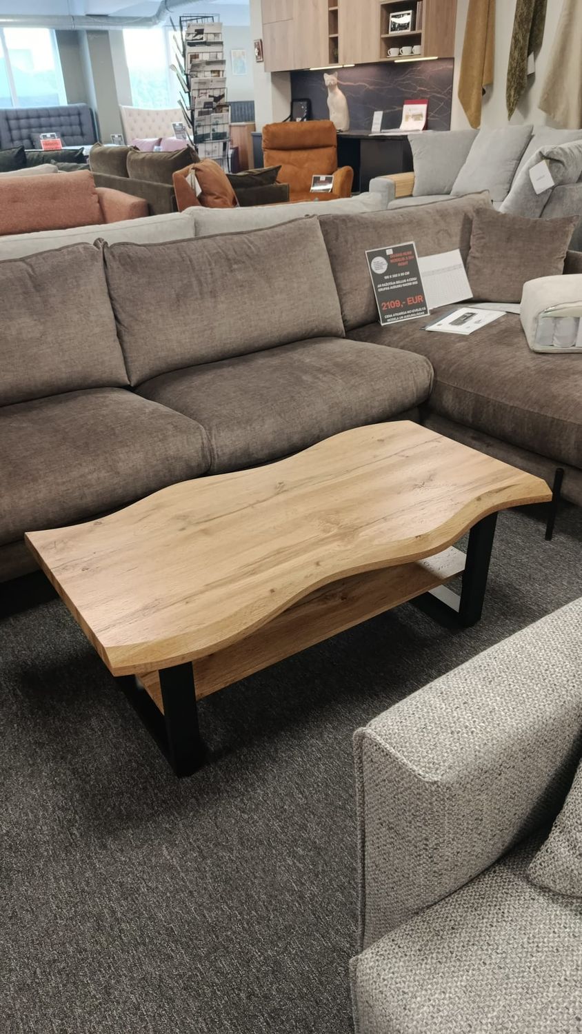 Coffee table with wavy edges, 110 x 60 x 43 cm. Wood-look finish, black legs. Manx Mēbeles furniture store in Jelgava