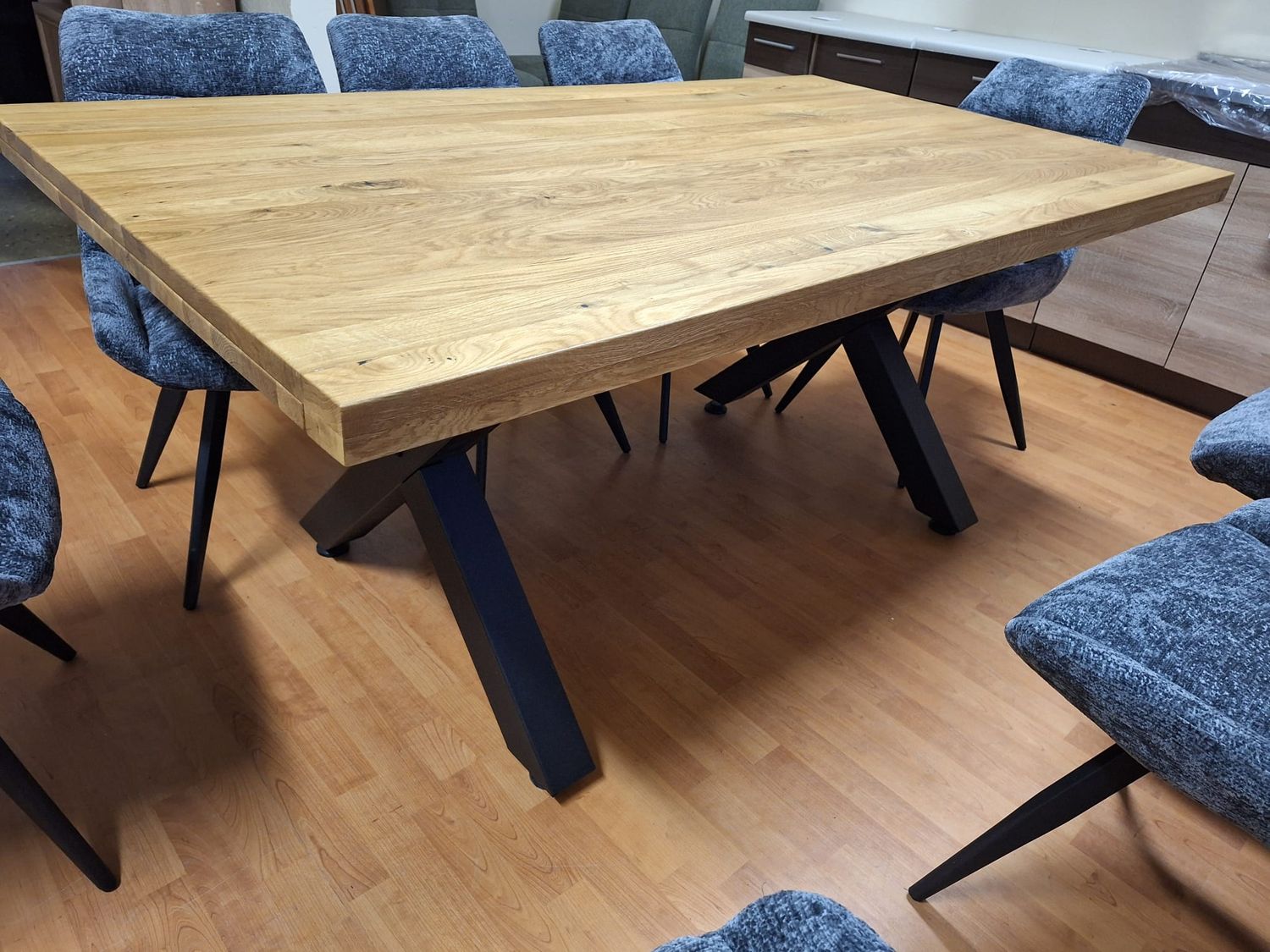 An oak table with black metal legs. Dimensions: 180 x 100 cm; 220 x 100 cm  Available at Manx Mēbeles