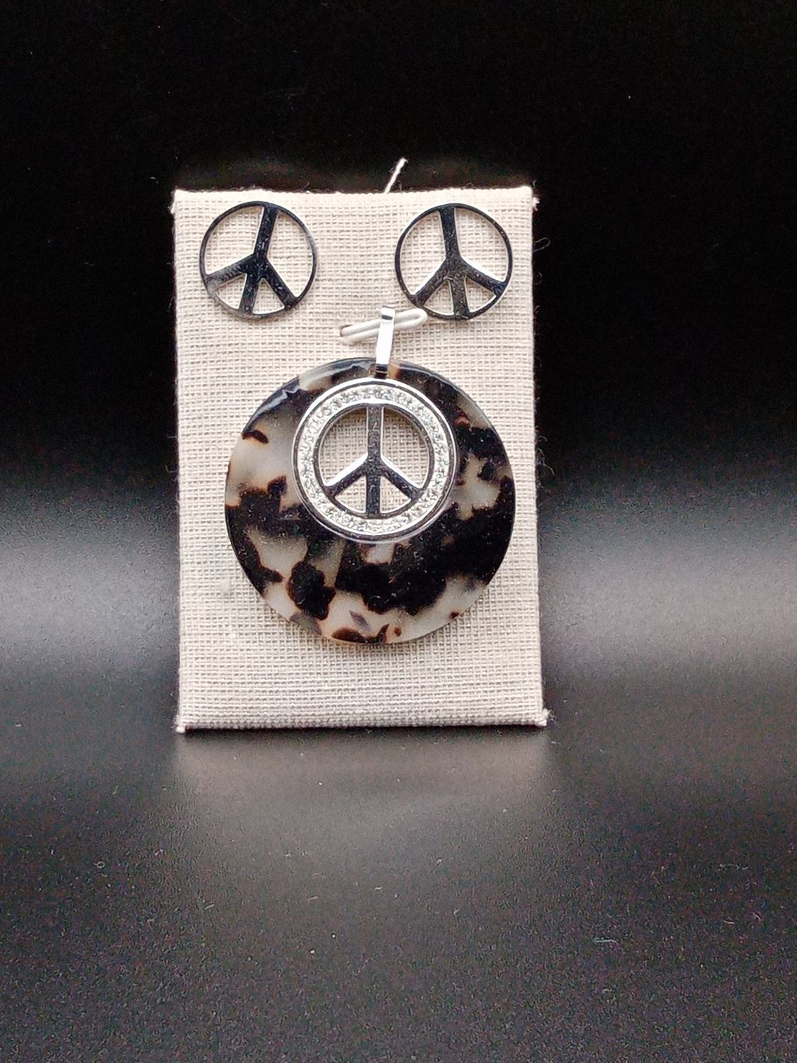 Conjunto símbolo paz ( acero y resina)