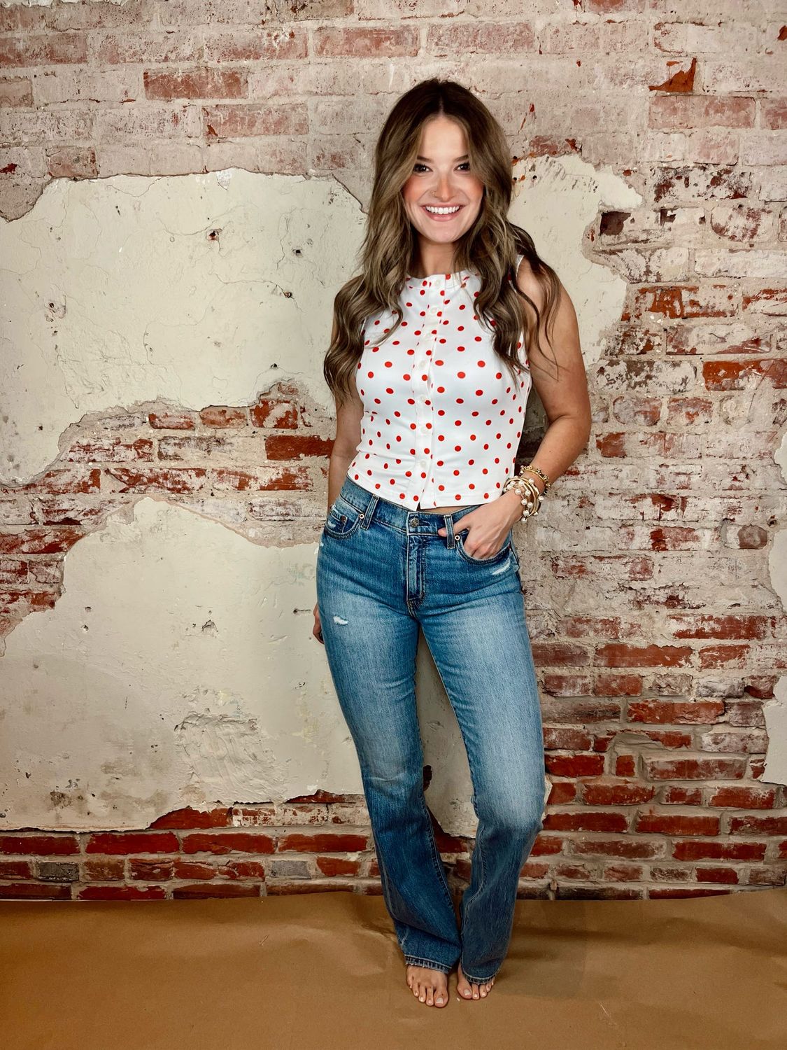 Blue denim flare jeans with subtle distressing