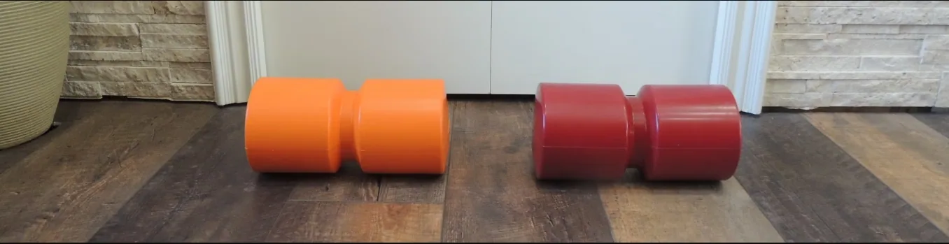 Back Trac spinal fitness roller in orange and maroon densities