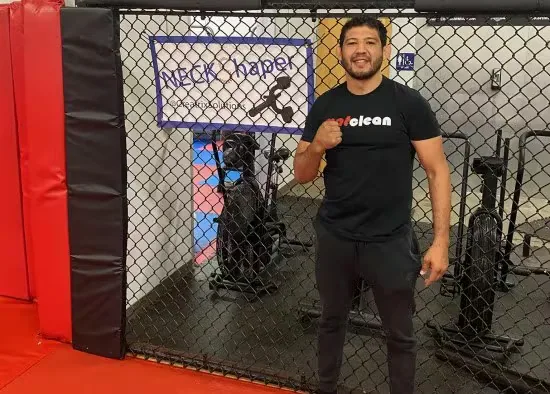 Athlete in gym with Neck Shaper banner