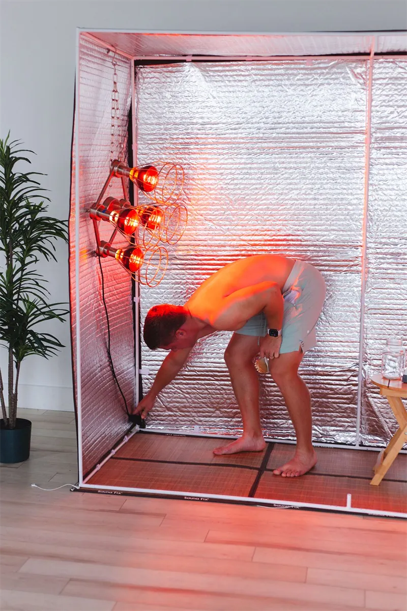 Forward fold mobility stretch in the near infrared sauna