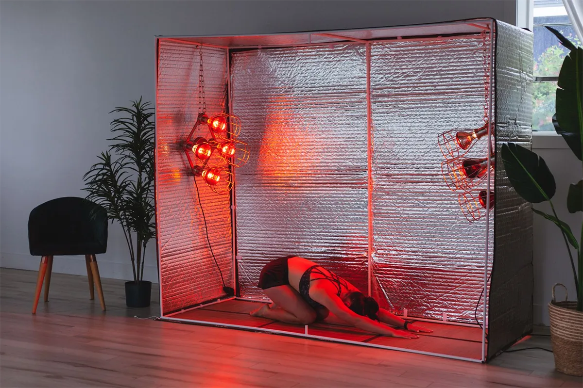 Floor exercises inside the near infrared sauna tent