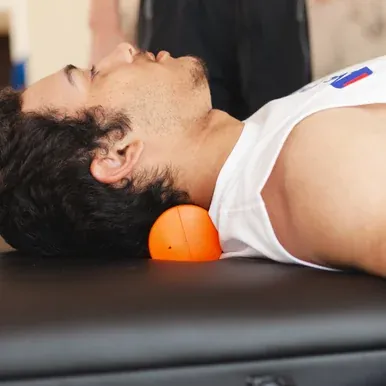 Neck Shaper Medium Density Roll fills the neck curve while the head rests on the surface.