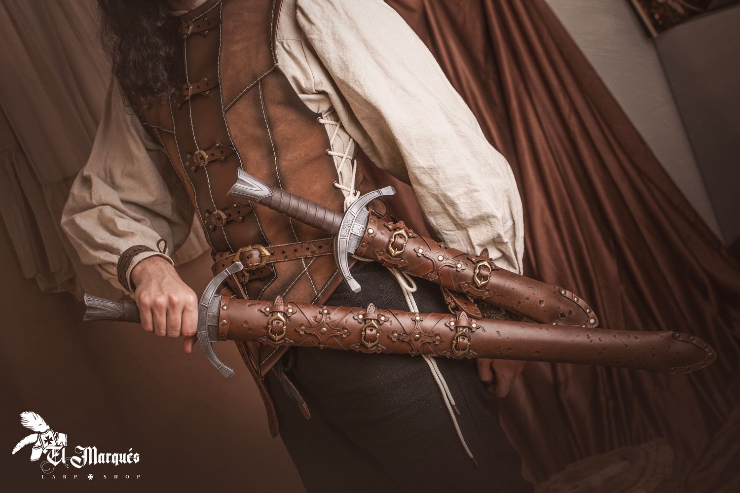 Leather scabbard set (sword and dagger) with belt.