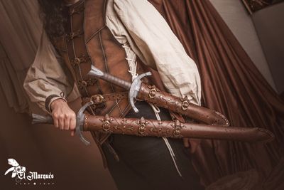 Leather scabbard set (sword and dagger) with belt.