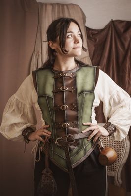 Short green leather vest