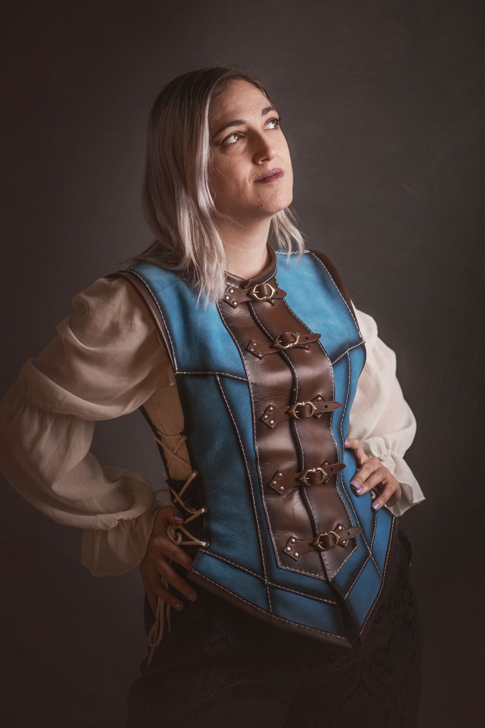 Short blue leather vest