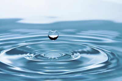 "Various water treatment chemicals displayed, including scale inhibitors, corrosion preventers, disinfectants, and coagulants, designed for improving water quality in industrial and residential systems."