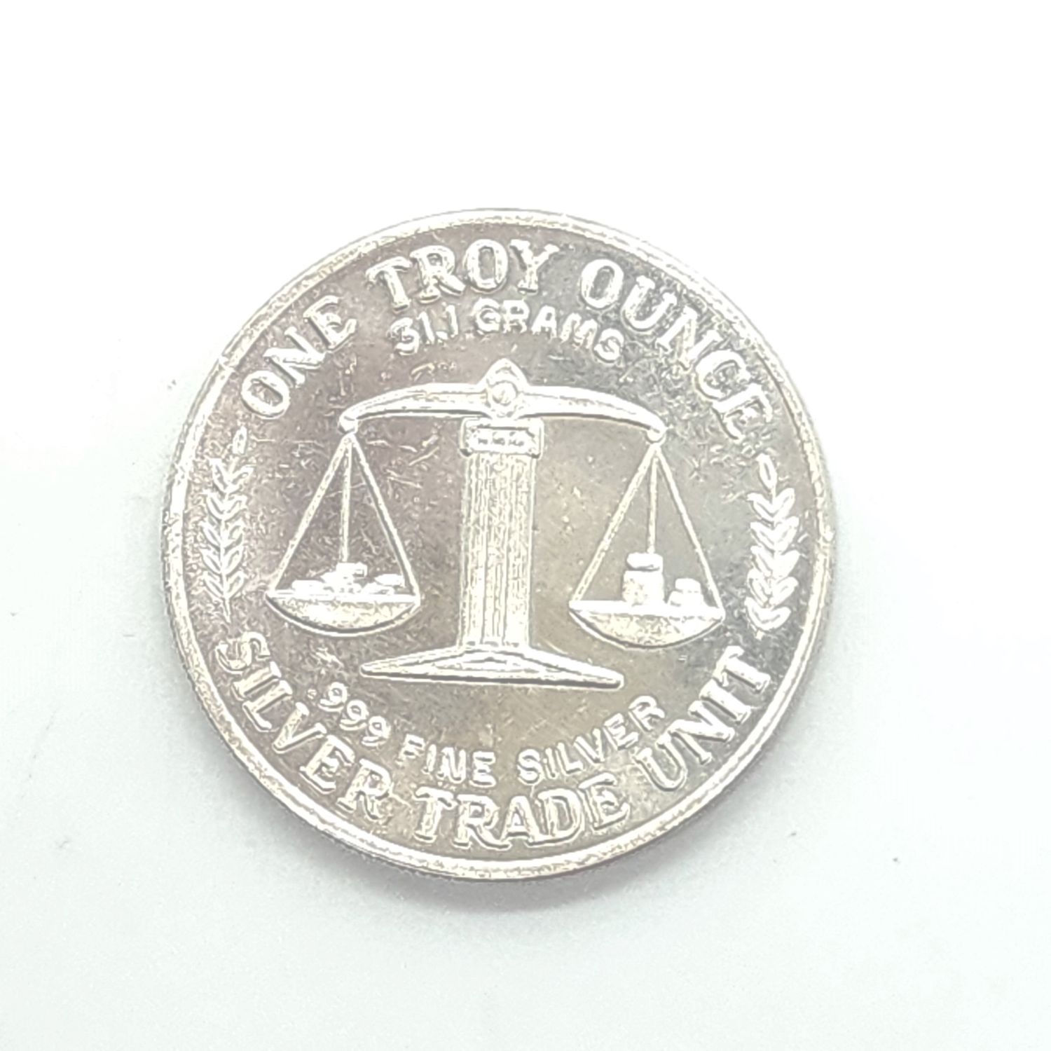 1oz Silver Trade Unit Round.