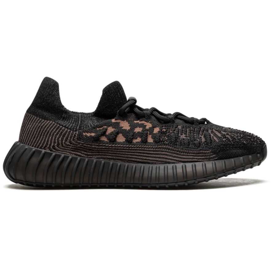 Side view of Adidas Yeezy Boost 350 V2 CMPCT ‘Slate Carbon’ sneaker in black and tan Primeknit with ribbed black sole and sock-like collar