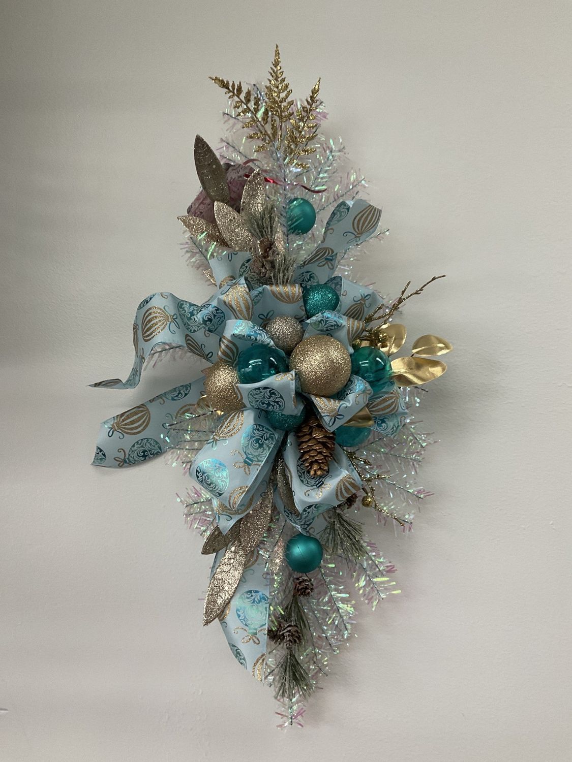 Swag Iridescent with Pinecones, Blue and Gold Ornaments and Ornament Ribbon