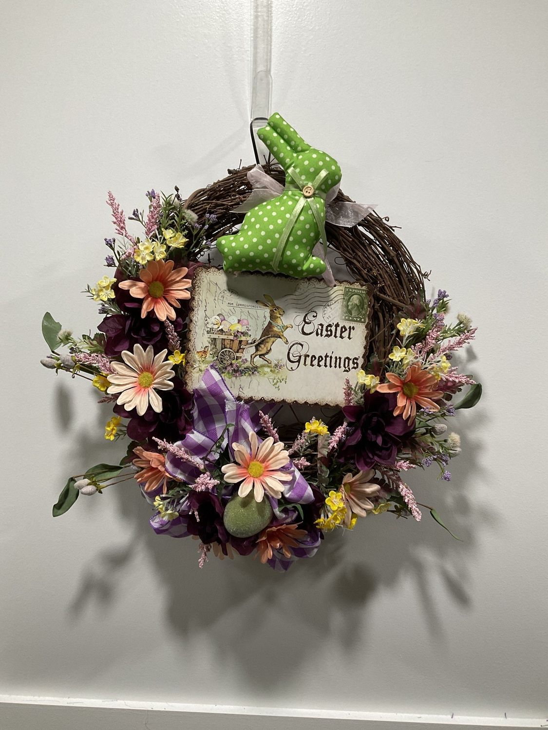 373 Wreath Grapevine 16 in-Green Bunny &quot;Easter Greetings&quot; w/Pink Flowers and Purple Check Ribbon