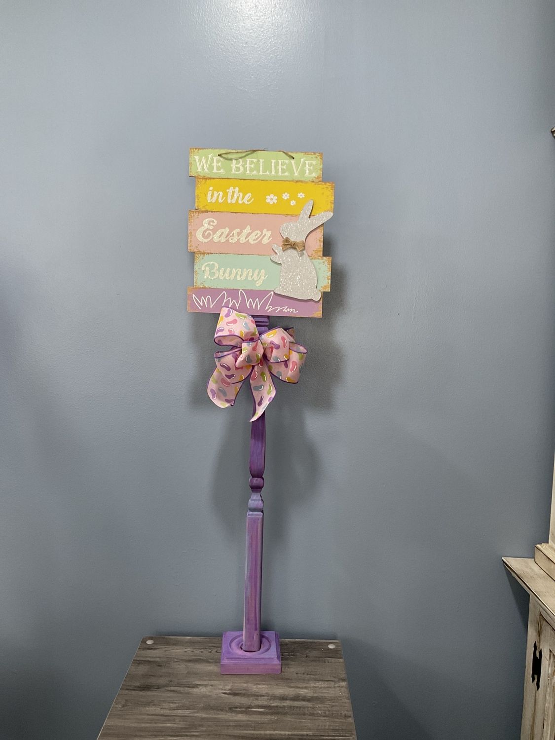698 Standing Sign 38 in-Purple w/&quot;We Believe In The Easter Bunny&quot; and Pink Jelly Bean Ribbon