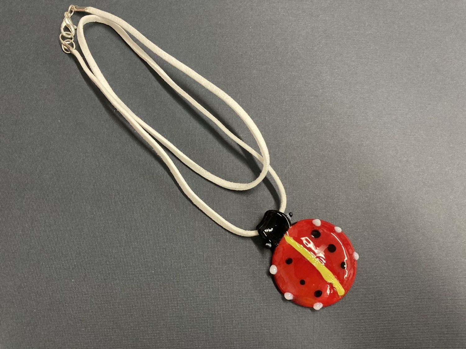 N217 Hand Made Glass Ladybug Pendant with a Suede Necklace