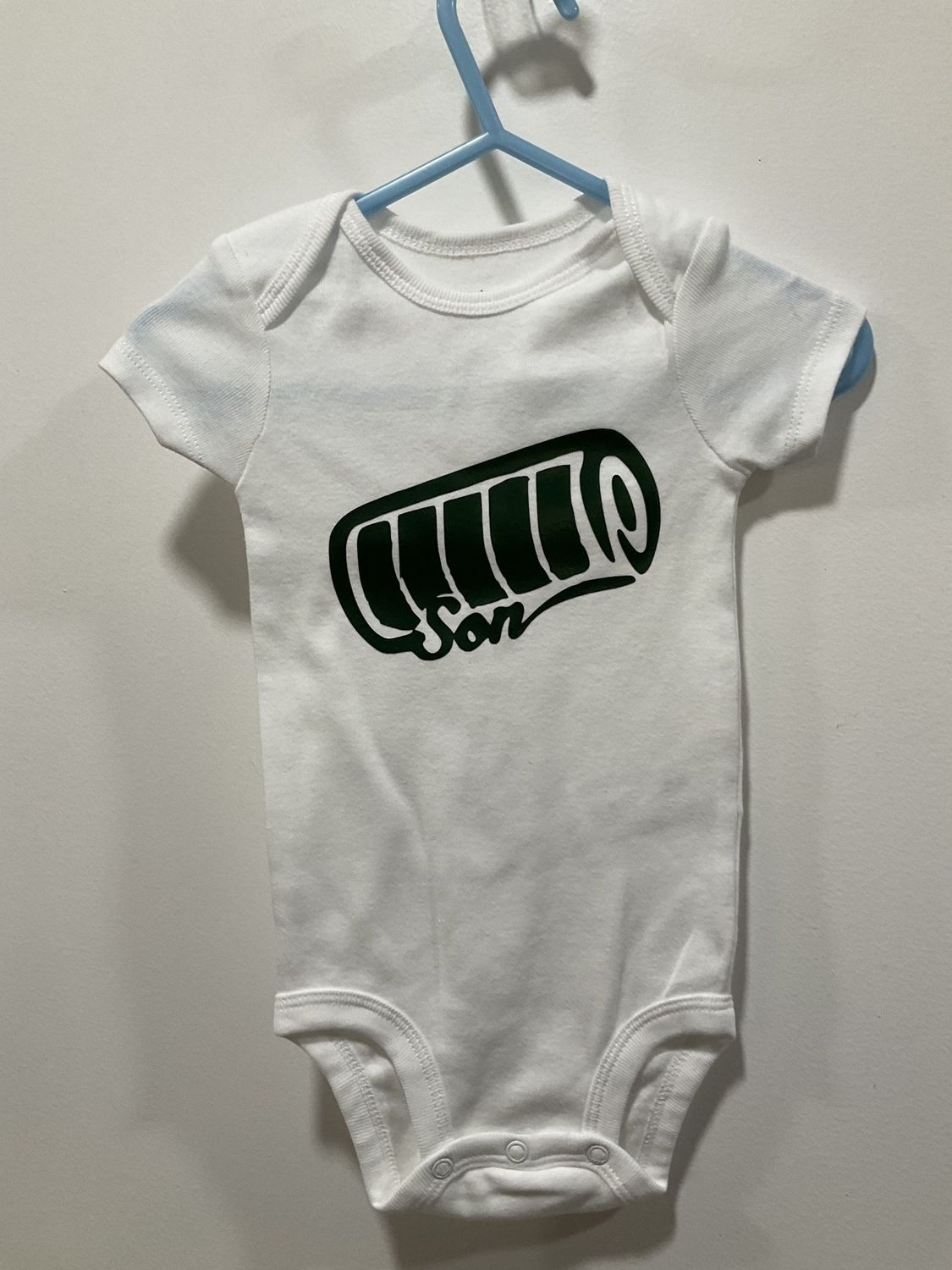 White onesie with Son on the front 6m
