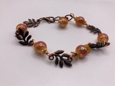 Bronze Leaf Bracelet with Gold spacer Beads and Orange Pearl Sheen