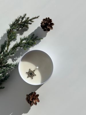 Soy candle in a white metal tin with lid. Fragrance "Frost-kissed window"