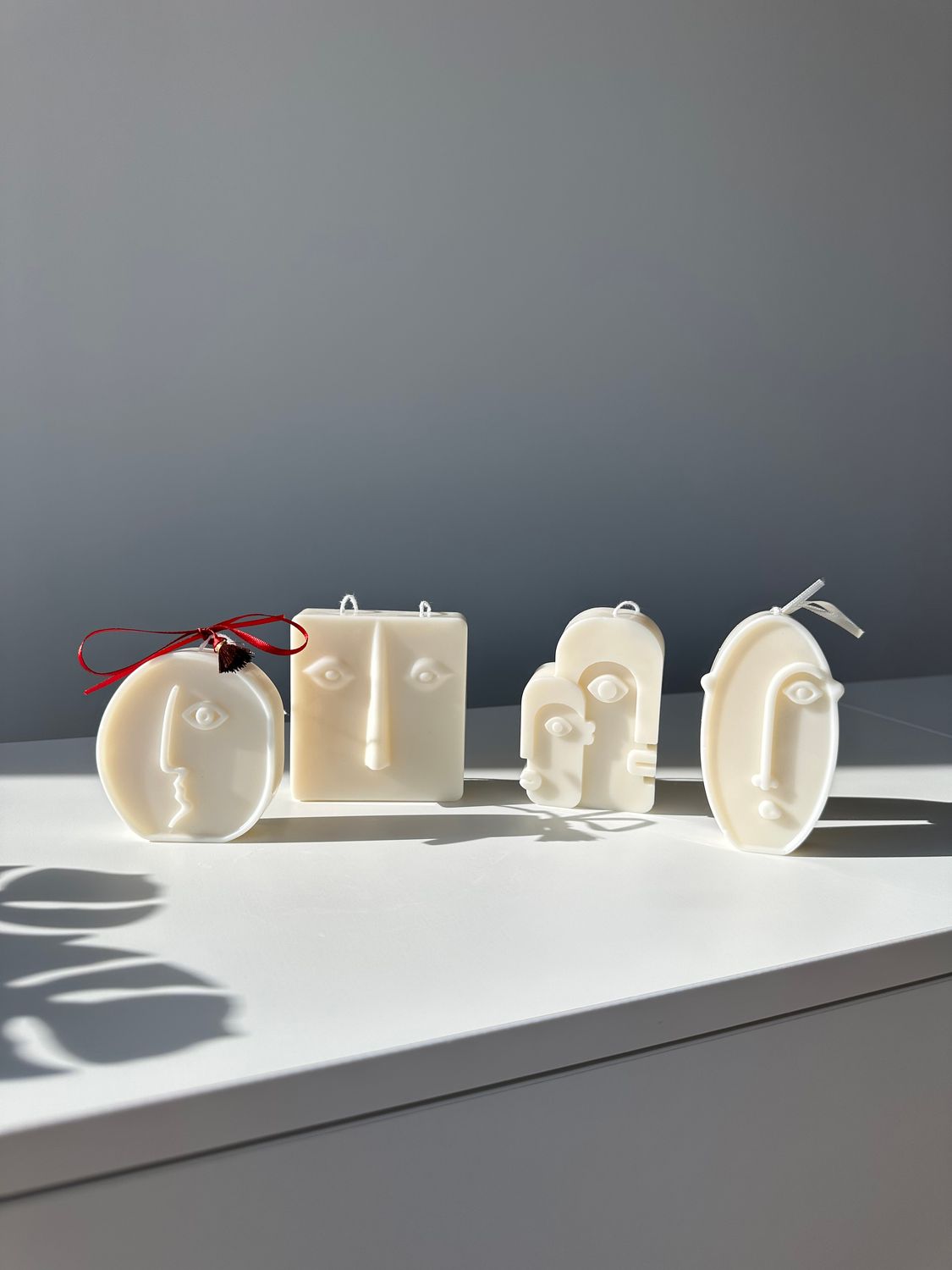 Faces set of four candles