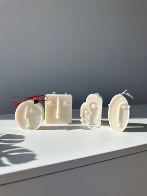 Faces set of four candles
