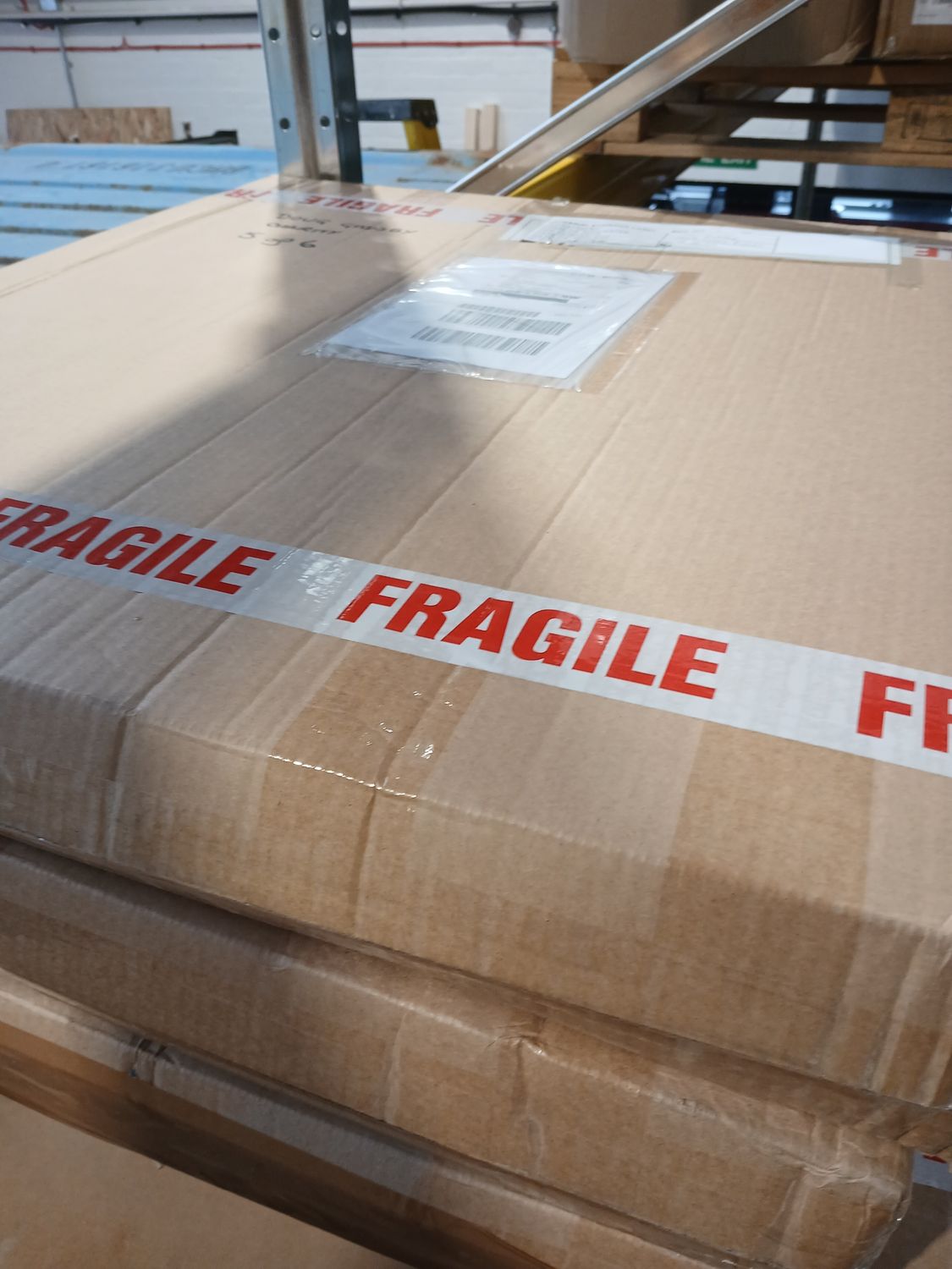 2 pallets of commercial goods ( middle right of shelf)
