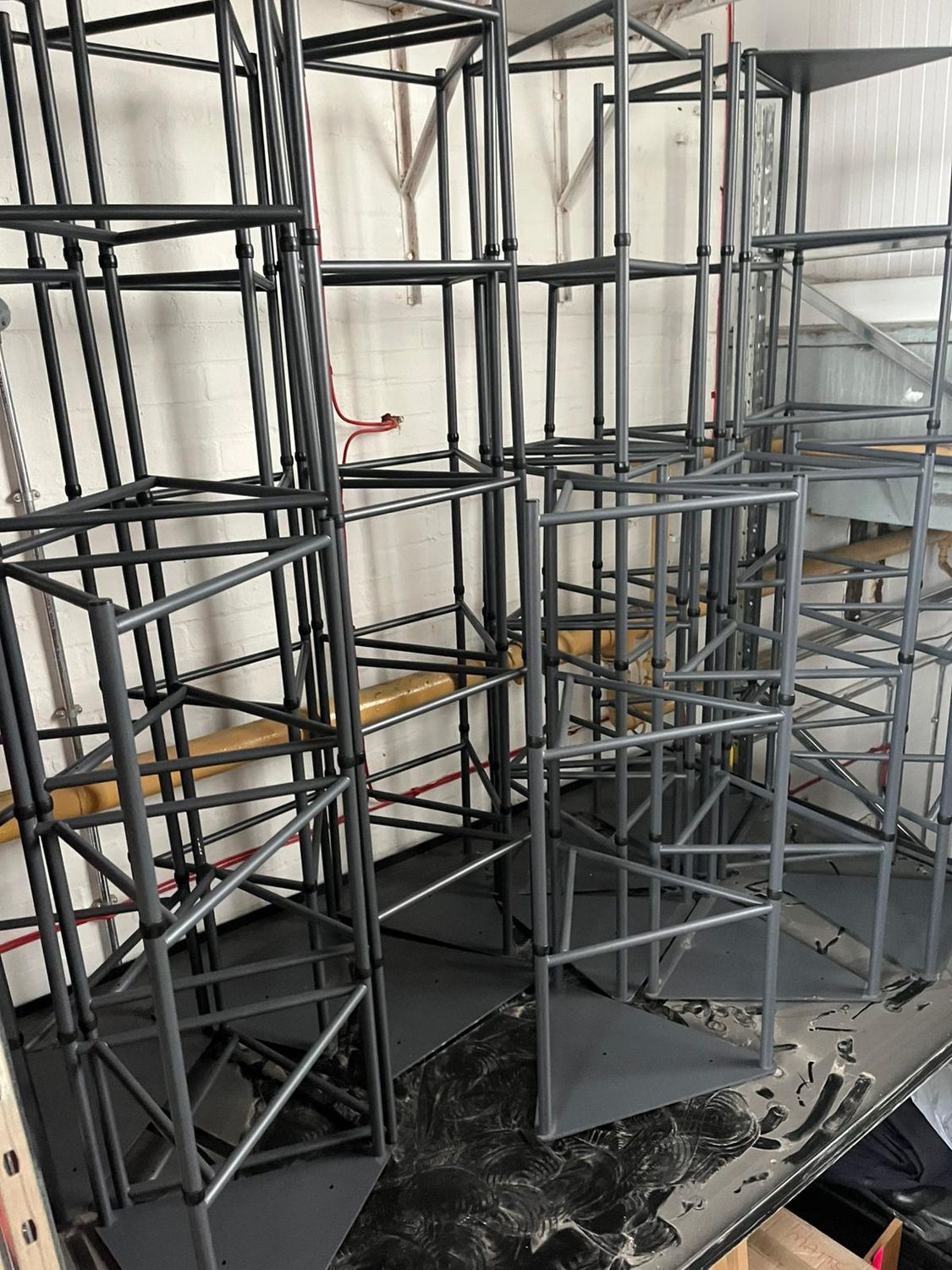 3 pallets of triangle shelving units ( top of bay 5)