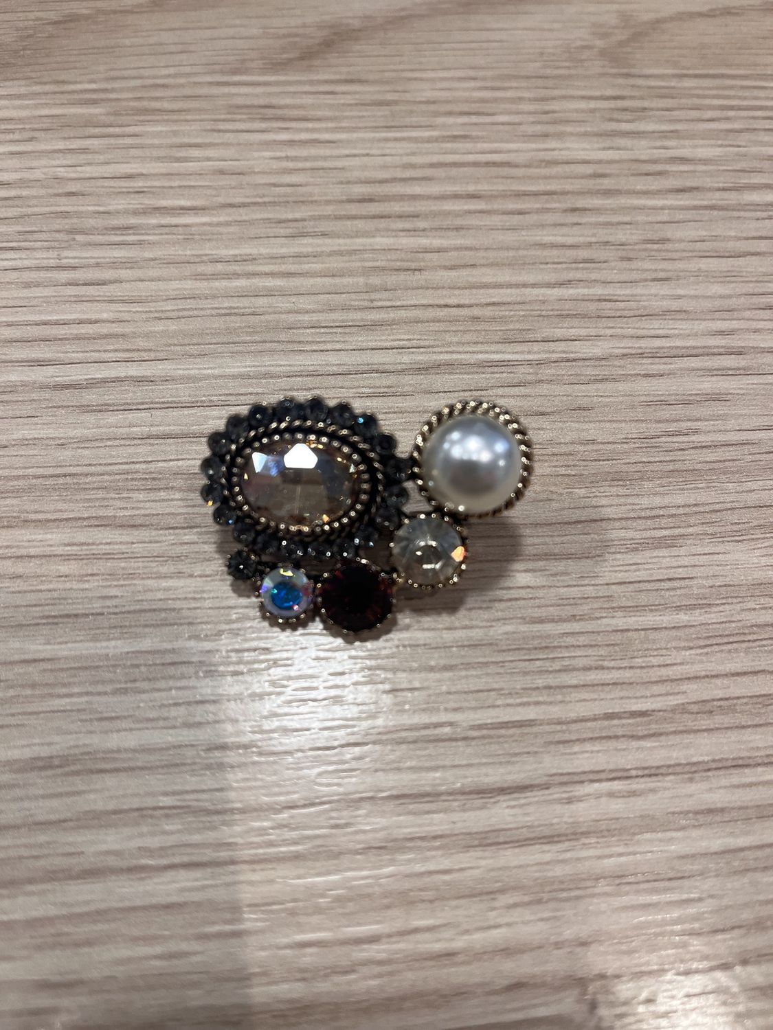 Pin goud oog