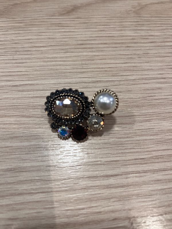 Pin goud oog