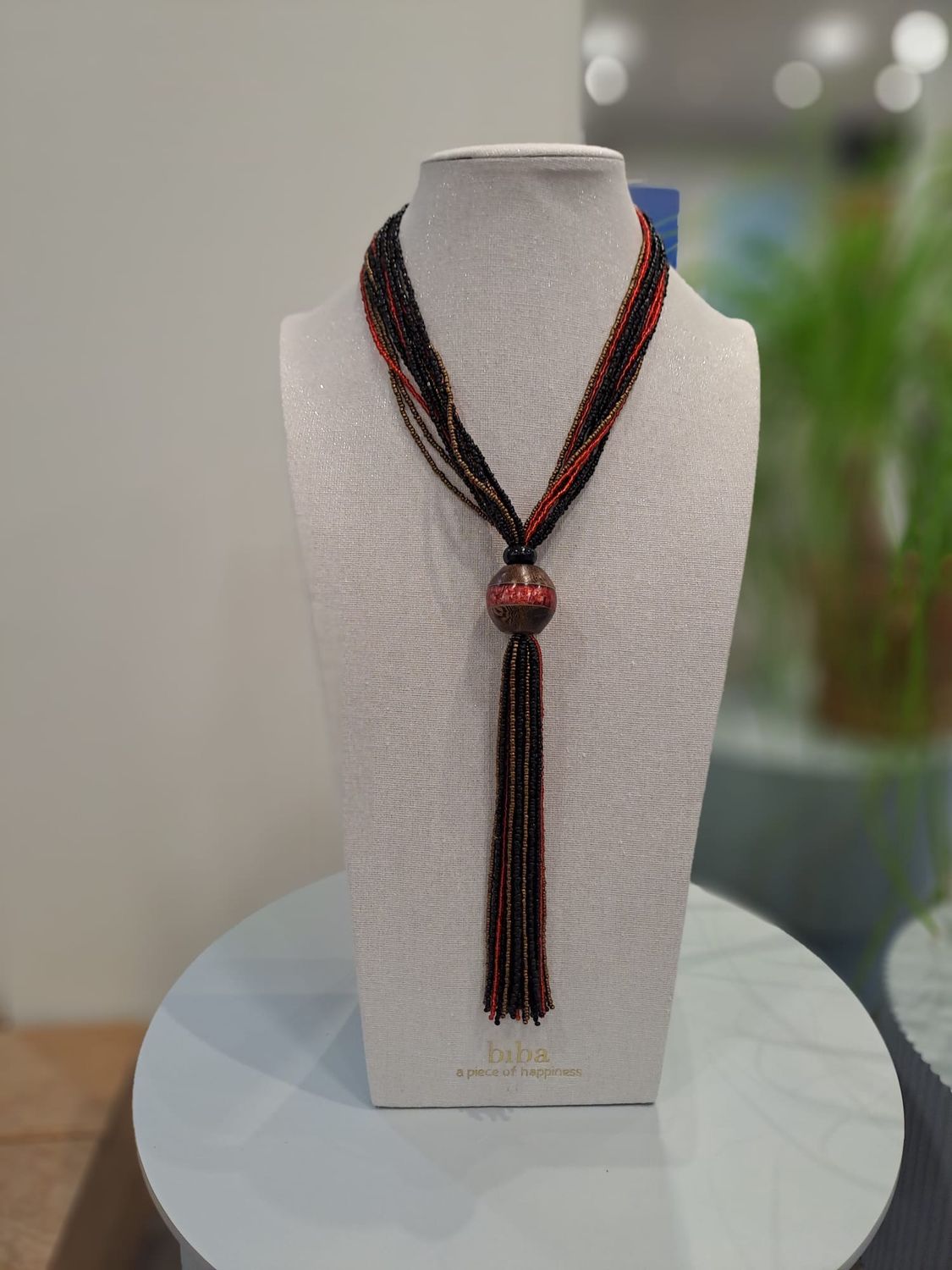 Ketting met grote bal en diverse kleine kraaltjes