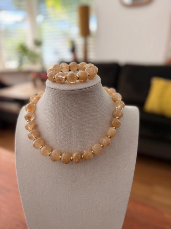 armband beige met klein goud ringetje